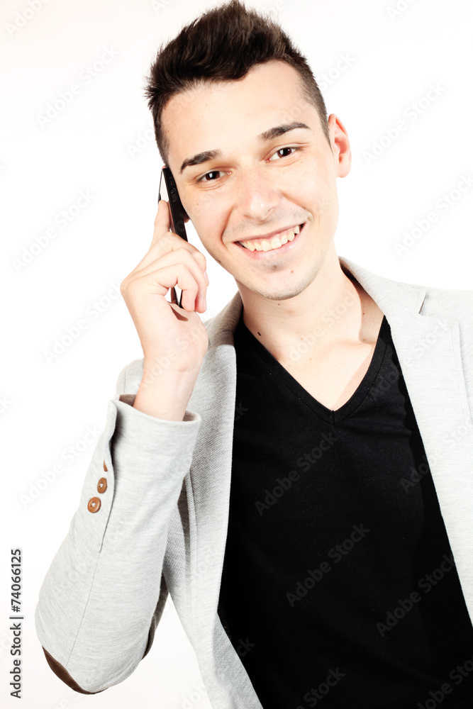 Fashion guy portrait with mobile phone on white background Fashion guy portrait with mobile phone on white background