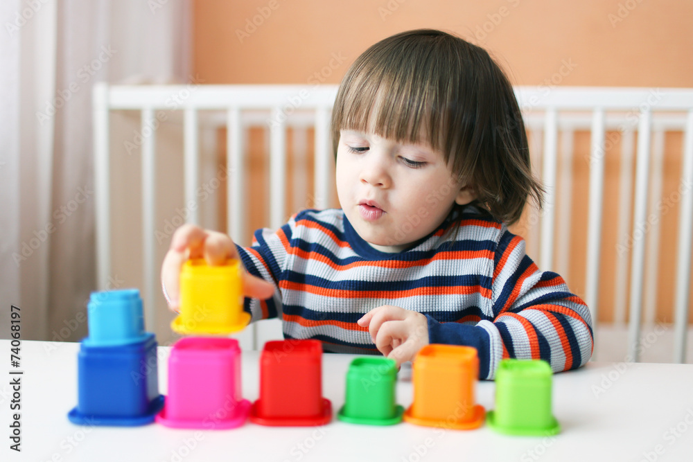 lovely 2 years toddler playing plastic blocks lovely 2 years toddler playing plastic blocks