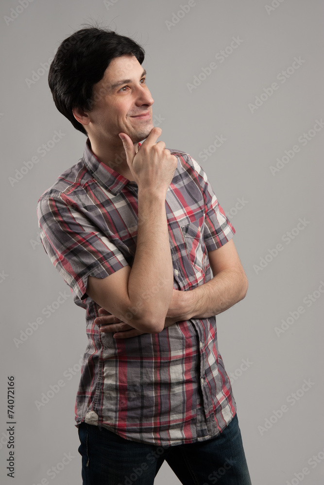 casual man looking up and thinking casual man looking up and thinking