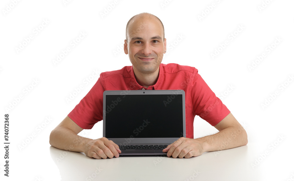 smiling bald man presenting something on laptop smiling bald man presenting something on laptop