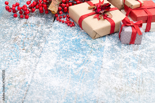 christmas ornament in snow on wood background. studio shot