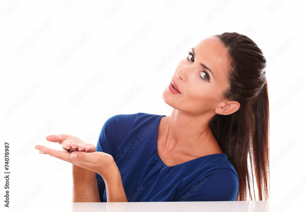 Lovely woman in blue shirt holding palms up Lovely woman in blue shirt holding palms up