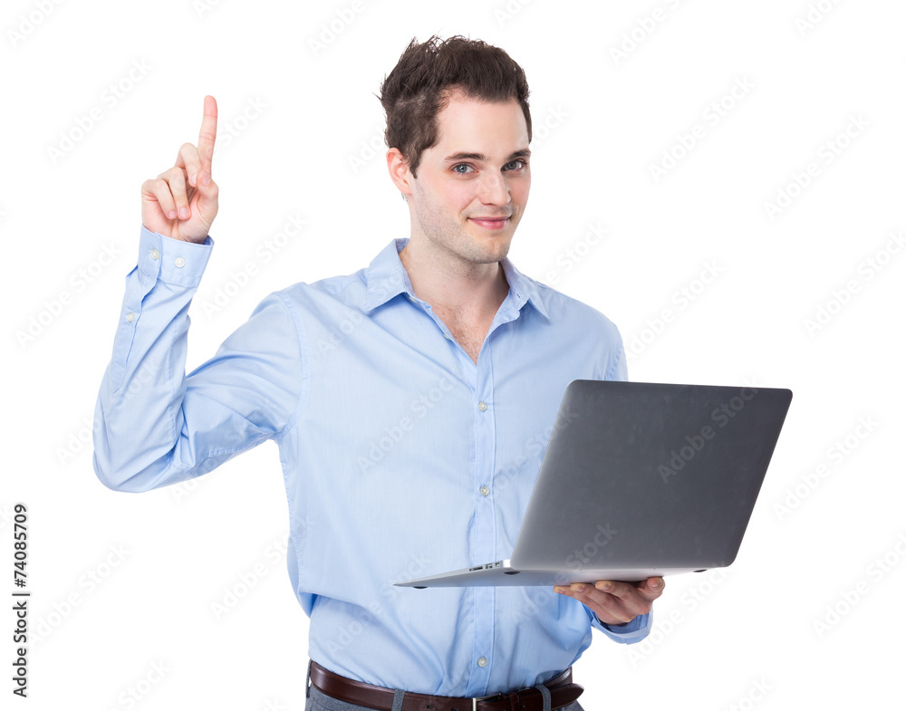 Businessman use of laptop and finger point up Businessman use of laptop and finger point up