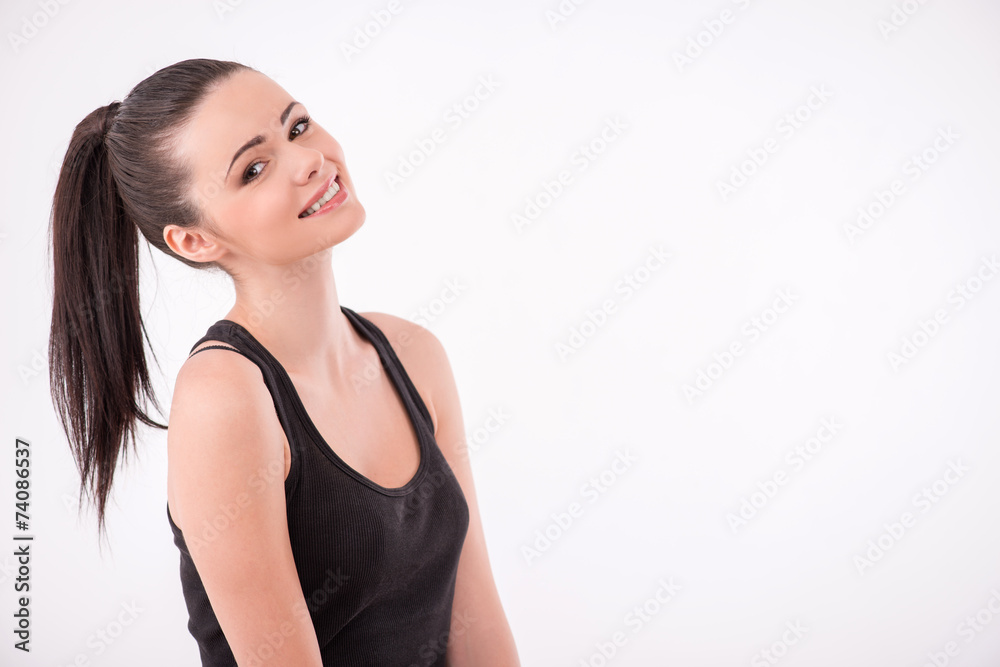 Healthy young sportswoman does the exercises Healthy young sportswoman does the exercises
