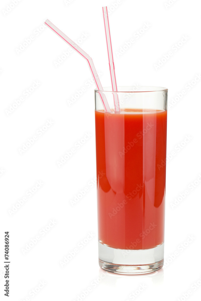 Tomato juice in glass with two drinking straws Tomato juice in glass with two drinking straws