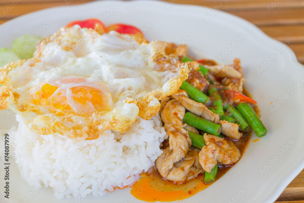Chicken and cowpea fried with chillies ,fried egg Chicken and cowpea fried with chillies ,fried egg