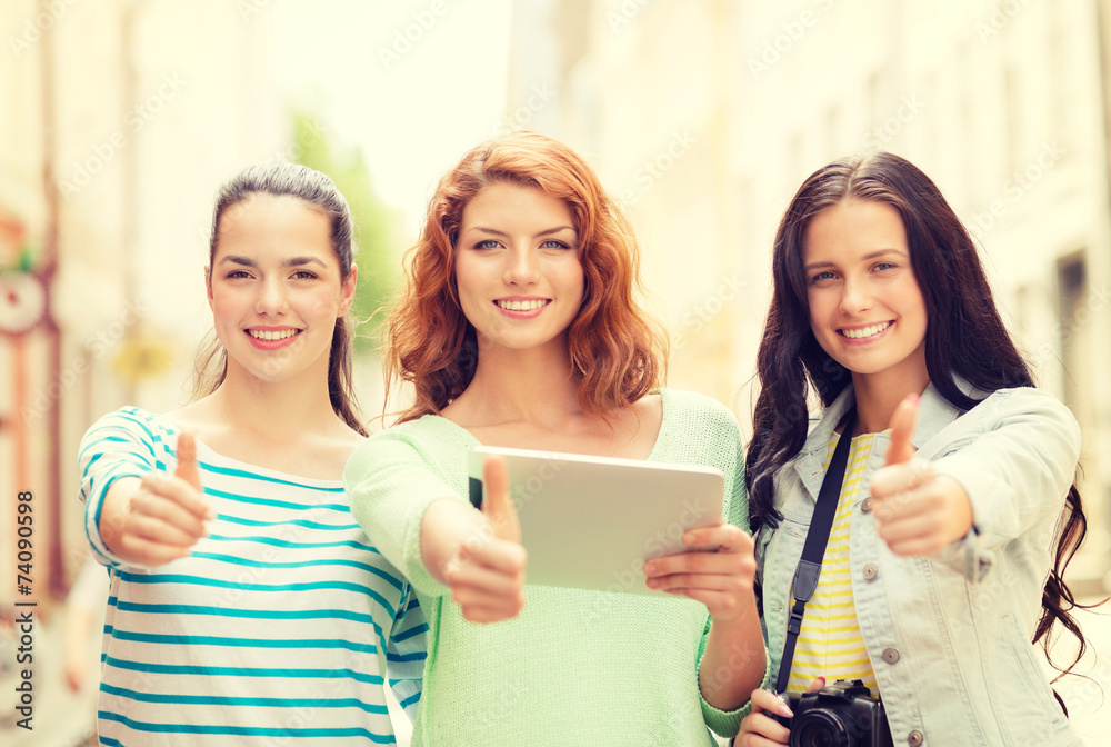 smiling teenage girls with tablet pc and camera smiling teenage girls with tablet pc and camera