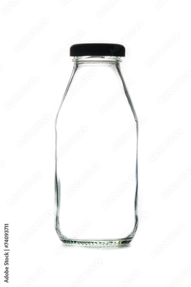 Empty glass bottle of milk with cap Empty glass bottle of milk with cap