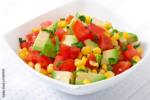 Mixed salad with avocado, tomatoes and sweet corn