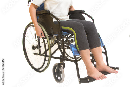 A disabled woman posing in a wheelchair isolated