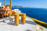 Ice coffee (frape) at balcony view view on caldera