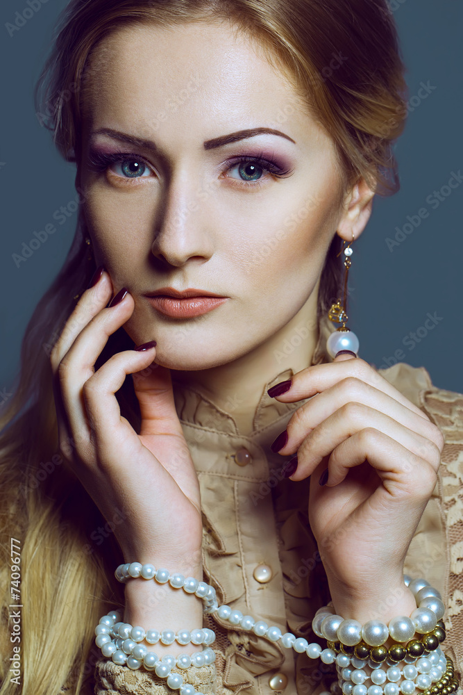 Obraz premium beautiful girl with perfect skin, blond hair and blue eyes posin