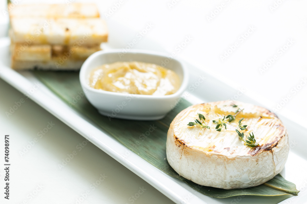 Mashed garlic sauce with bread croutons and roasted Camembert ch Mashed garlic sauce with bread croutons and roasted Camembert ch