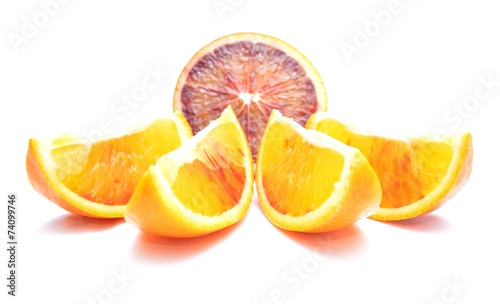 Slices of red oranges isolated on white background