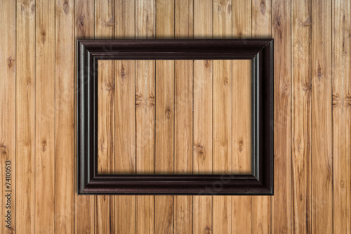 Picture frame on wood background with space