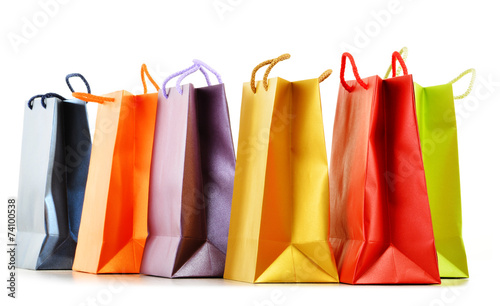 Colorful paper shopping bags isolated on white