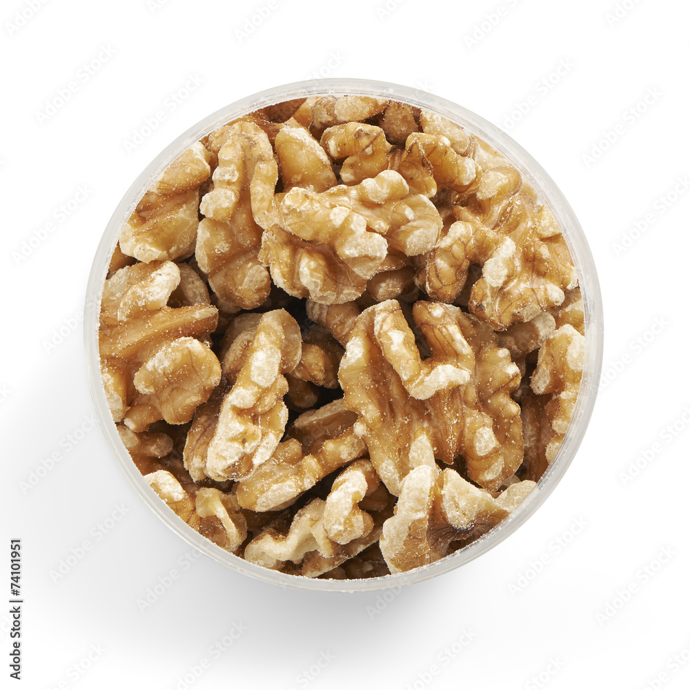 walnuts in a glass jar shot from above walnuts in a glass jar shot from above