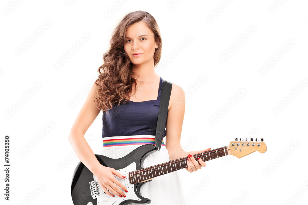 Fashionable woman holding an electric guitar Fashionable woman holding an electric guitar