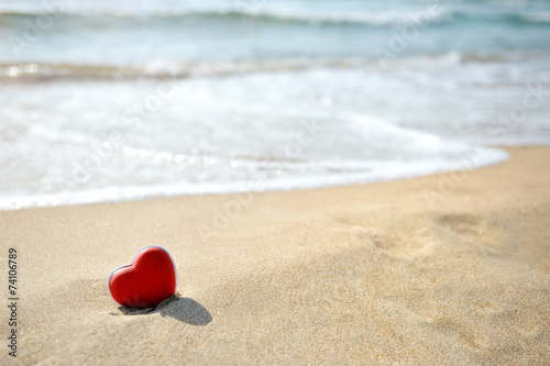 Obraz na płótnie red heart on sea beach - love relax concept w salonie