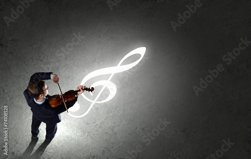 Businessman with violin photo