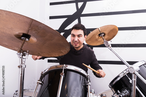 man playing drums photo