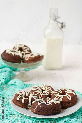 Chocolate donuts with white icing photo