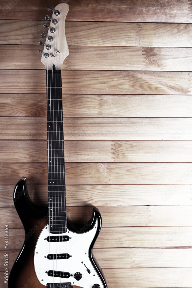 Fototapeta premium Guitar on wooden background