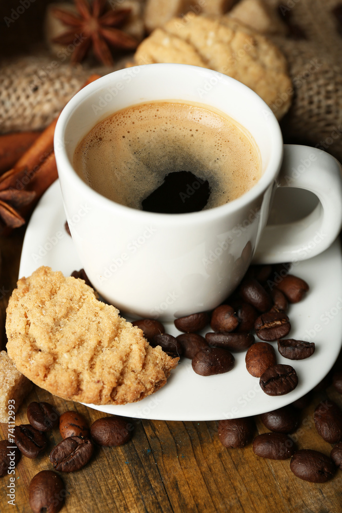 Cup of espresso and tasty cookie on wooden background Cup of espresso and tasty cookie on wooden background