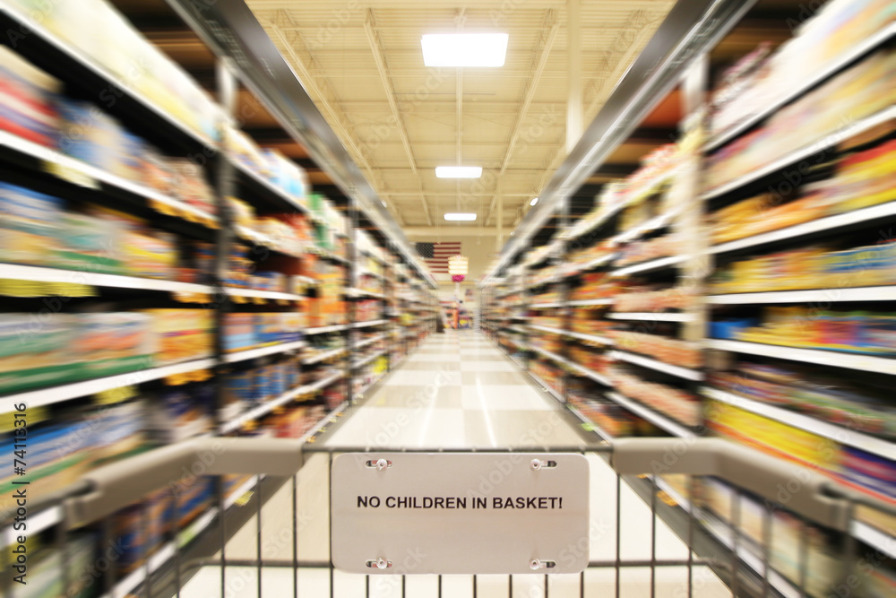 a blurred shot of an isle in a supermarket or grocery store shop