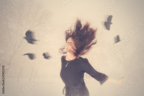 Photography a woman with birds flying around her head