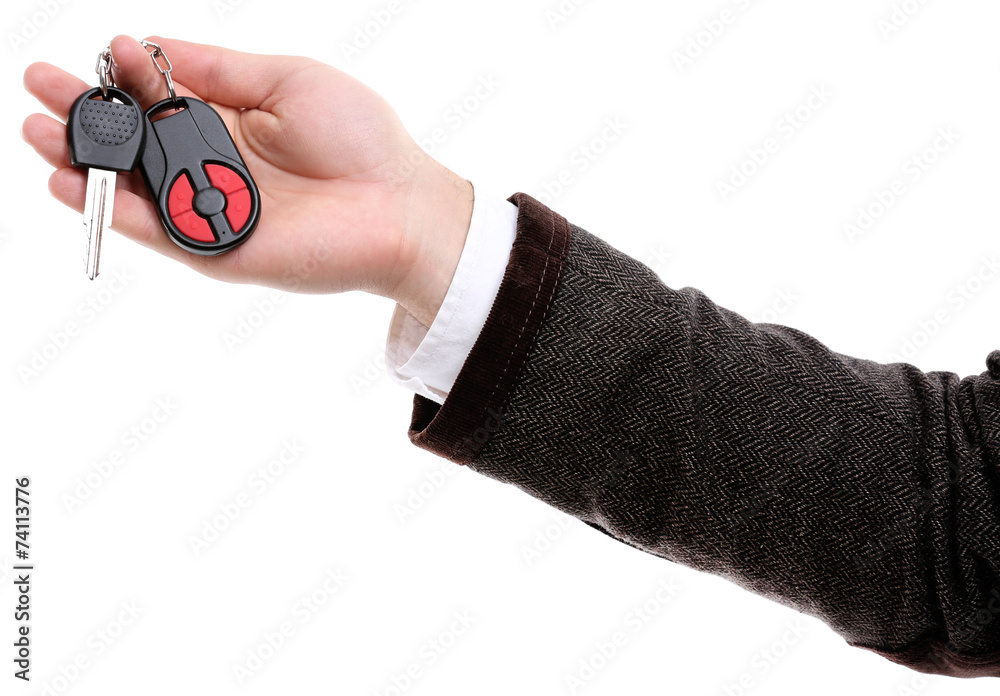 Businessman holding car key isolated on white Businessman holding car key isolated on white