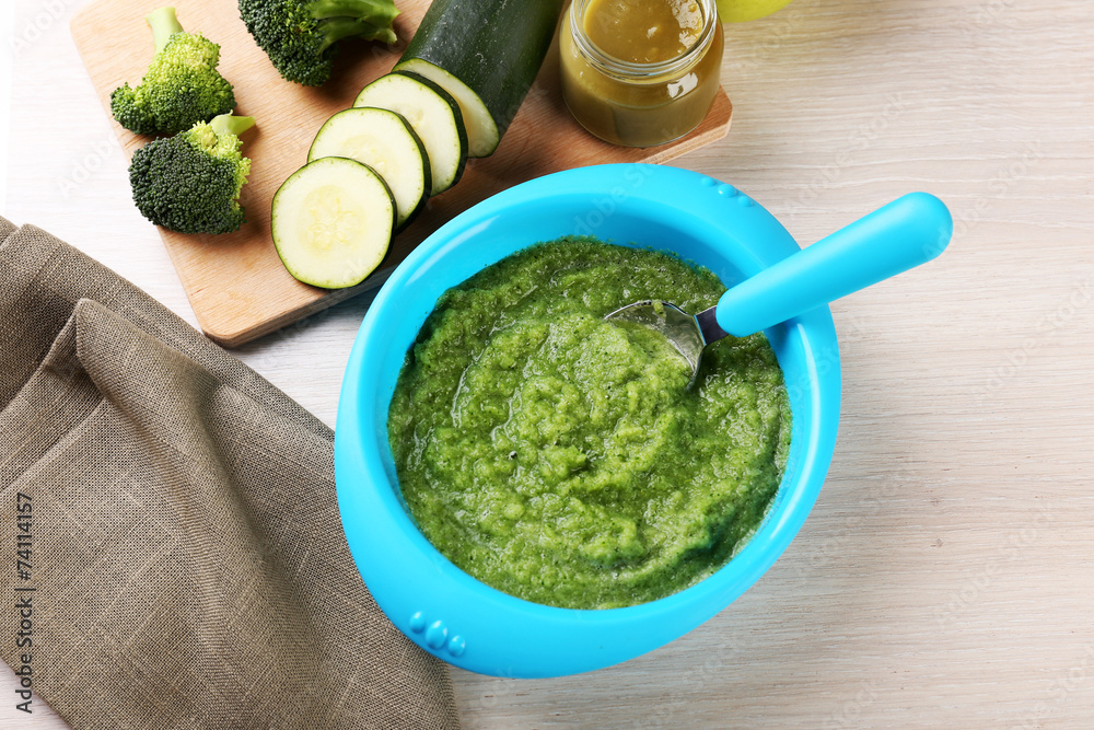 Fresh baby food in bowl with spoon Fresh baby food in bowl with spoon