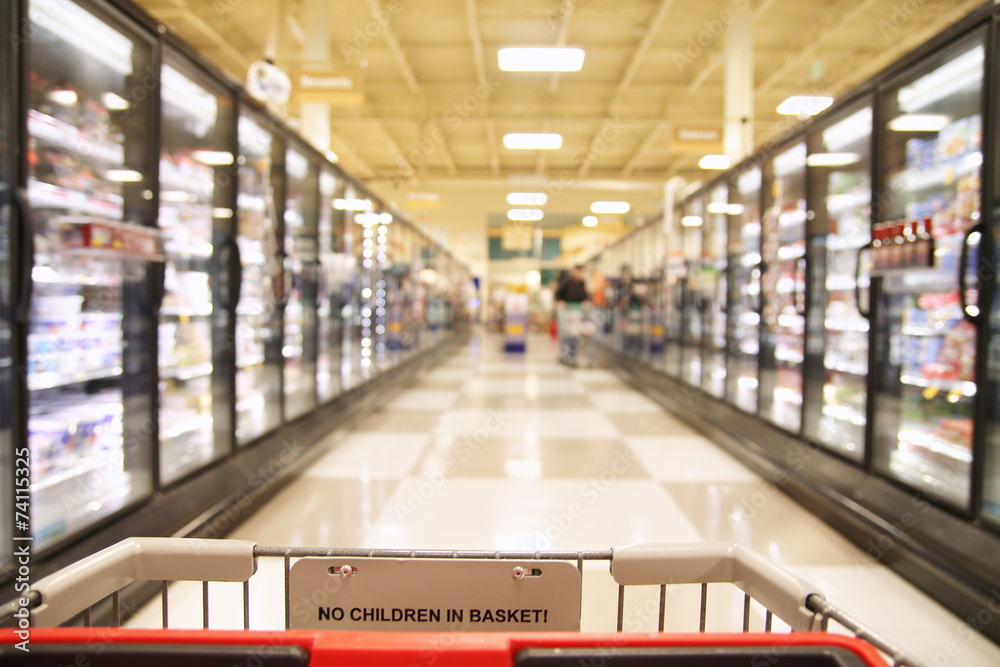 an aisle in a grocery store showing frozen foods