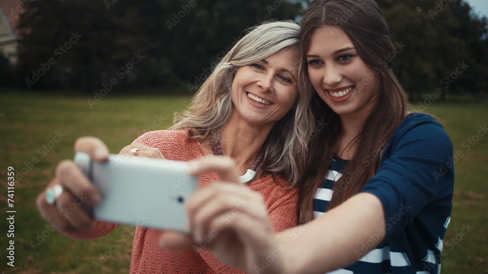 Mother and Daughter Take Selfie Together With Smart phone Mother and Daughter Take Selfie Together With Smart phone