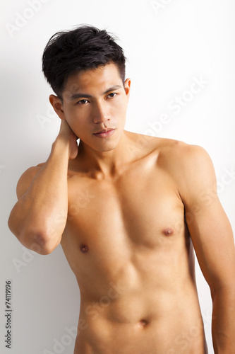 asian young sport man with perfect fitness body