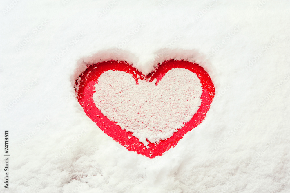 Valentine love red heart shape in snow on red car