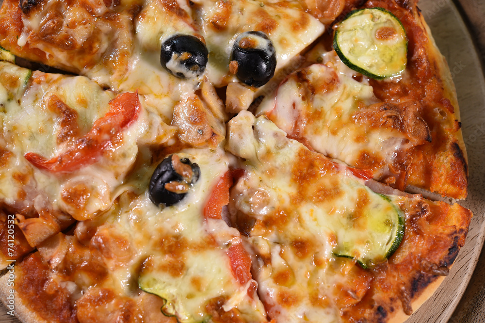 close up of pizza on wooden board. close up of pizza on wooden board.