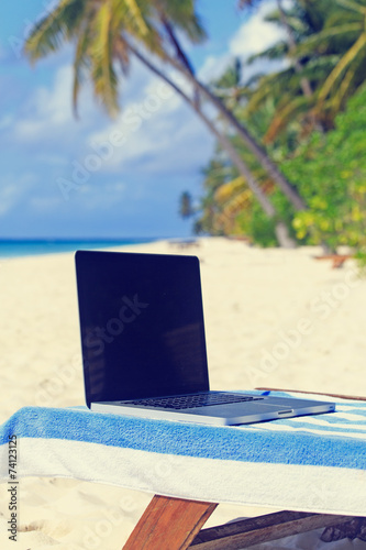 laptop on chair in beach vacation