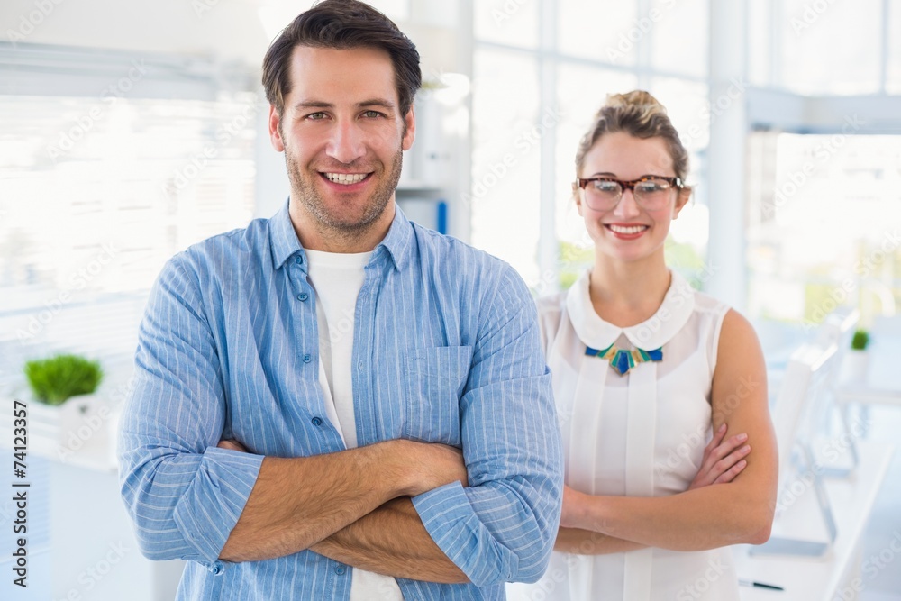 Fototapeta premium Smilling photo editor posing with arms crossed