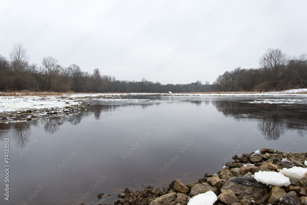 cold winter landscape with frozen river