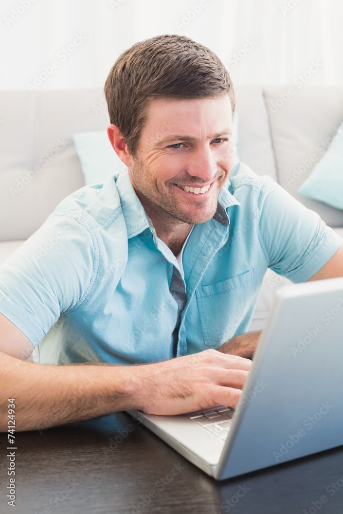 Smiling man on a laptop Smiling man on a laptop