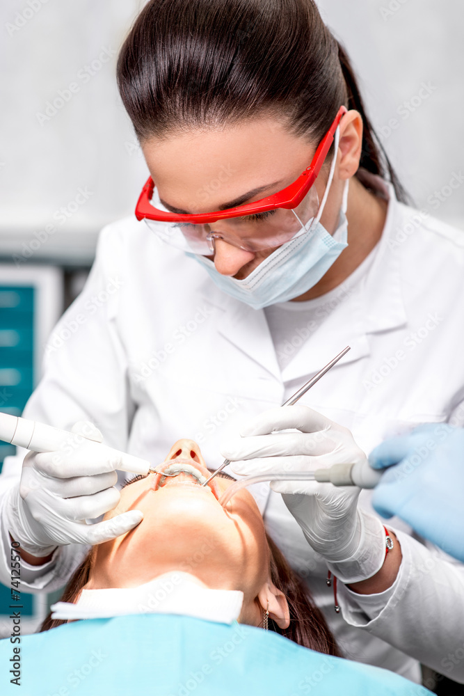 Naklejka premium Professional teeth cleaning