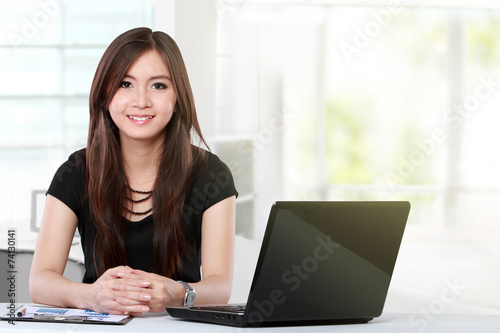 pretty business woman with laptop