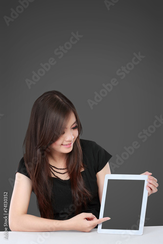 businesswoman showing blank tablet