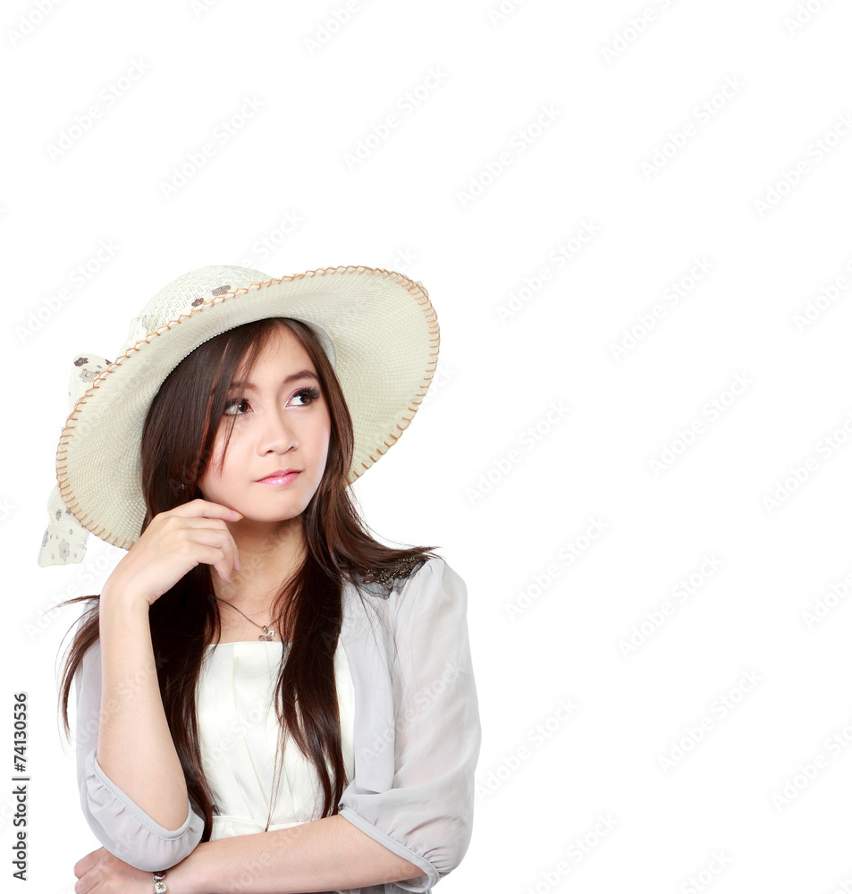 young asian woman thinking and looking up to copy space young asian woman thinking and looking up to copy space