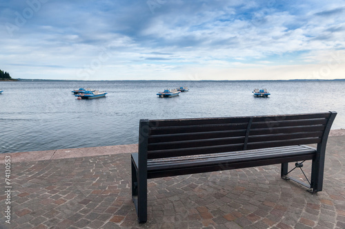 Wood bench at the Garda lake
