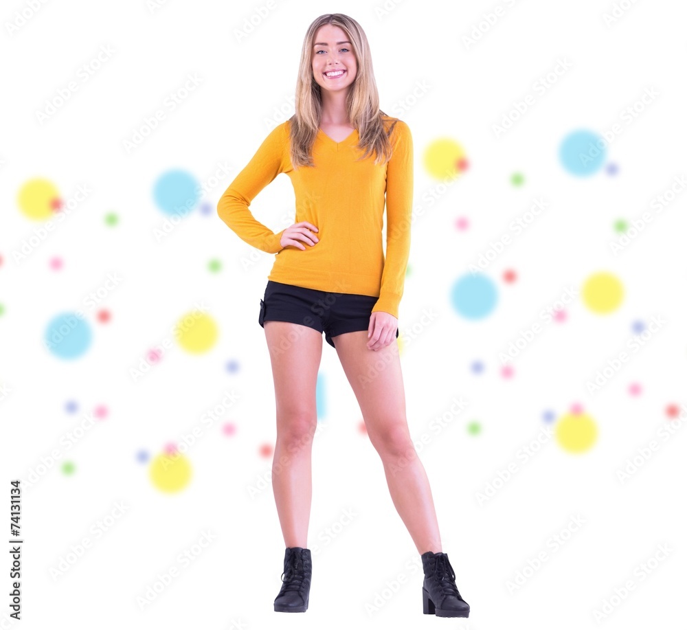 Composite image of stylish blonde smiling at camera Composite image of stylish blonde smiling at camera