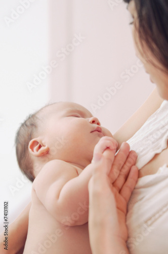 portrait of a mother with her newborn baby