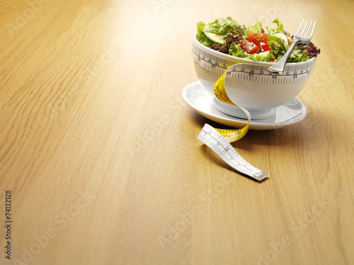 Dieting with a Bowl of Salad and Tape Measure