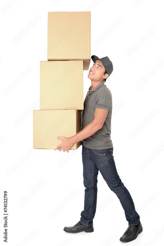 Man Holding some heavy Stack Of Cardboard Boxes Man Holding some heavy Stack Of Cardboard Boxes